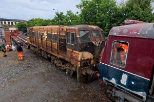 141 class loco 152 is winched down to ground level, with driver Mike enduring another shunt in the single-ended railcar.