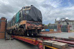 A class diesel loco A3r is carefully lowered off the lowloader at Downpatrick.