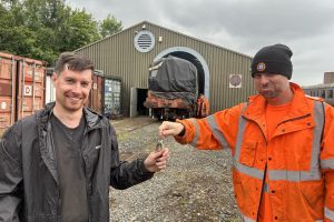 Fiachna hands over the A class keys to DCDR Chairman Rob.