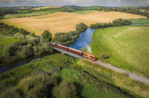 121 class locomotive 124 hauls its vintage carriages bonnet first over the Quoile Bridge.